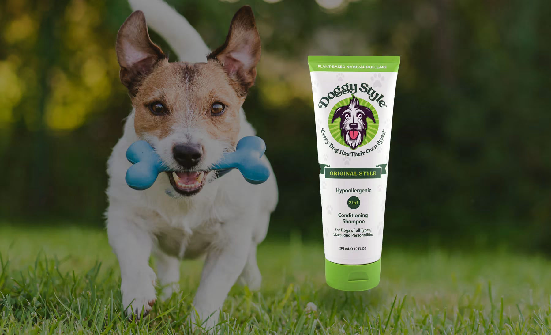 Dog running with a blue bone toy and a tube of Douchy Style product in the grass.