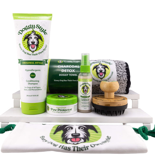 Dog grooming products including shampoo, conditioner, towel, and brush on a white background.